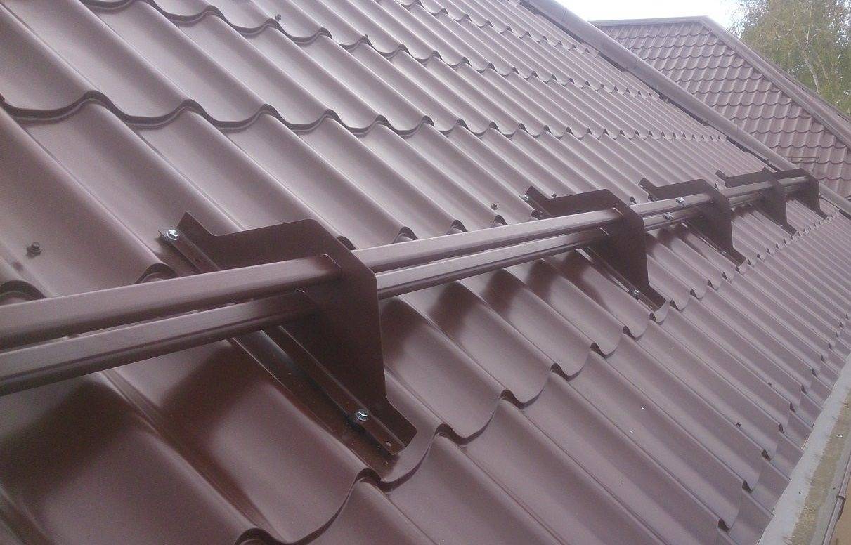 Устройство и установка снегозадержателя на крышу — фото и видео обзор